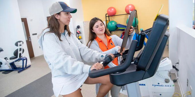 Person on a treadmill and the other taking data